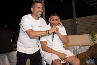 a couple of men standing next to each other