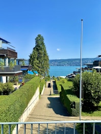 A modern residential neighborhood with well-planned plots and greenery under a clear sky.