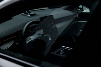 Dynamic shot of a modern car dashboard illuminated in black and white, reflecting automotive passion.