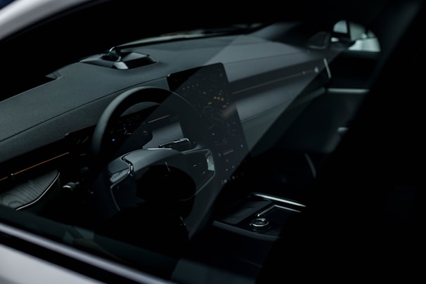 Close-up of a sparkling clean dashboard with polished surfaces reflecting natural light.