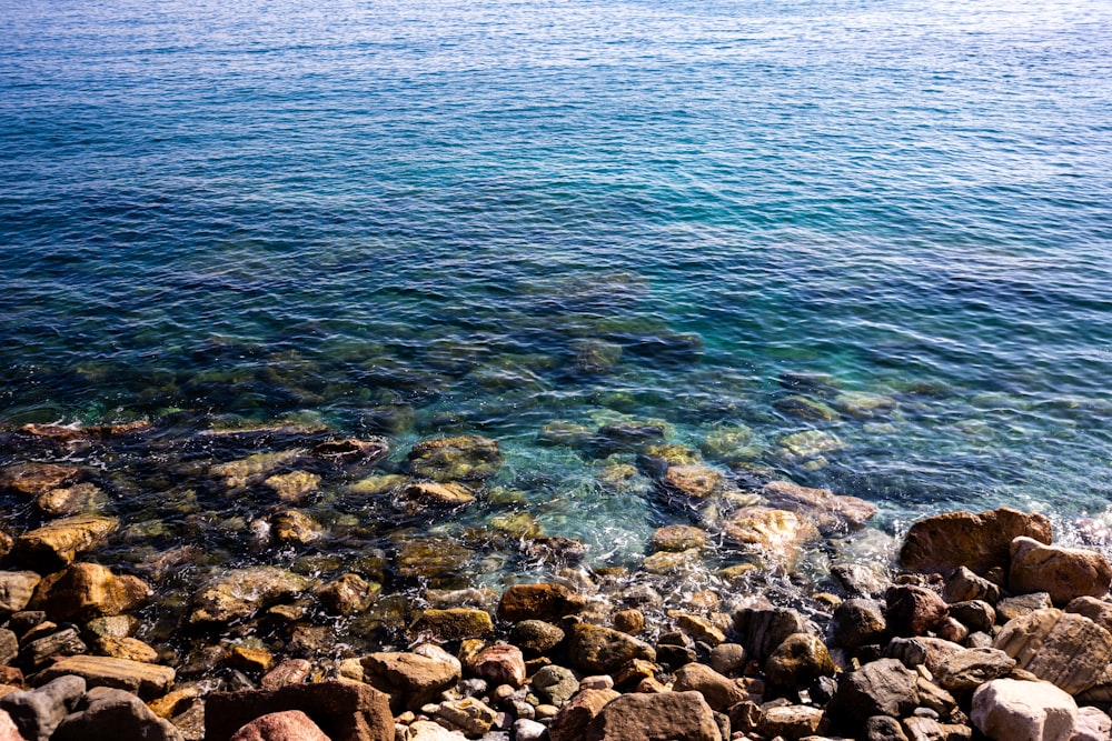 a body of water surrounded by rocks and rocks