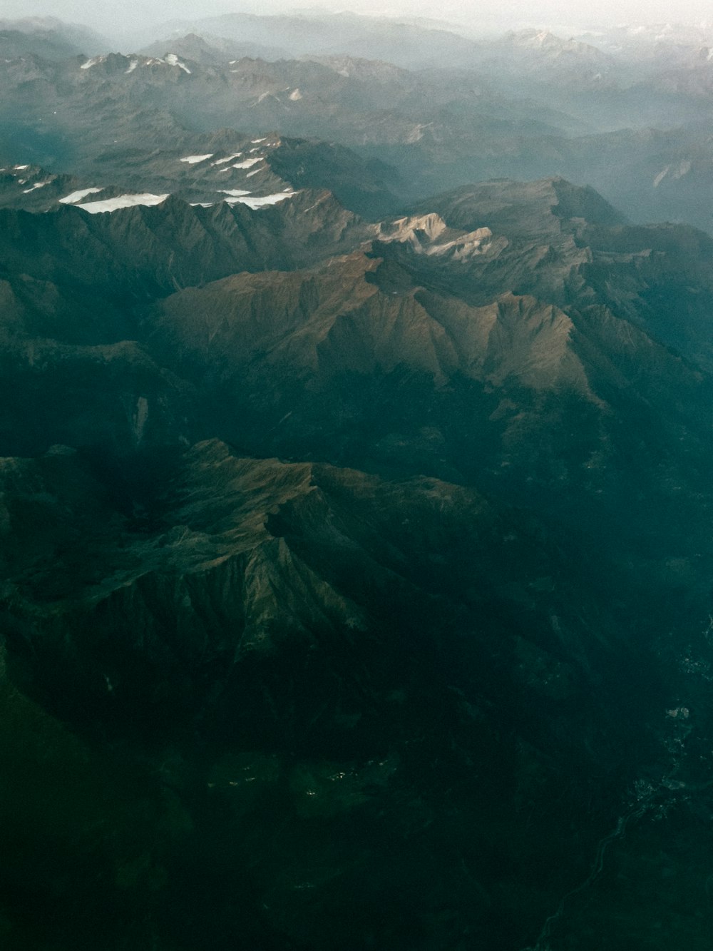 a view of a mountain range from an airplane