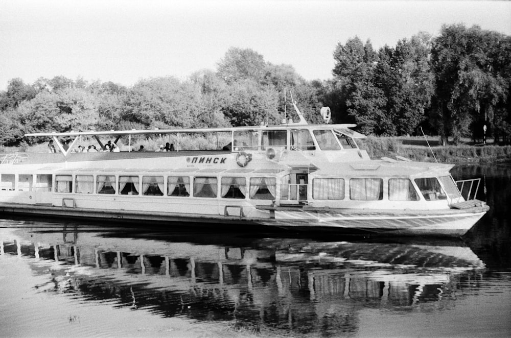 a black and white photo of a boat on the water