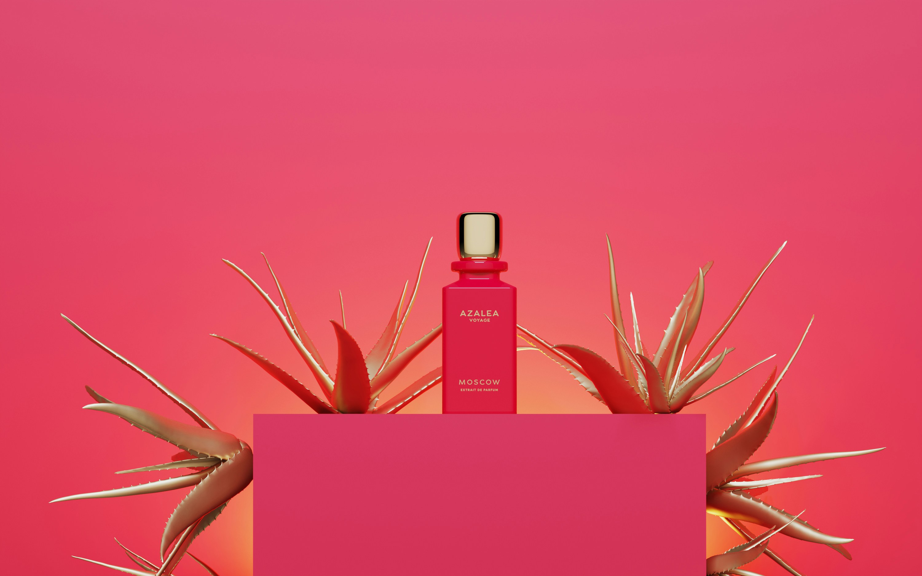 A bottle of perfume sitting on top of a pink box