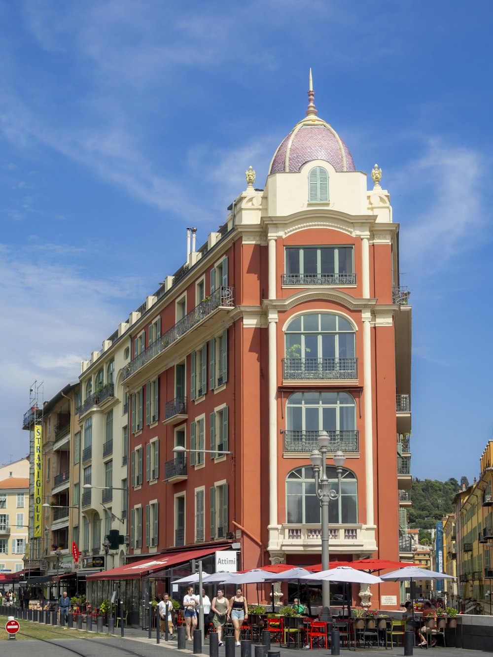 a tall building with a red and white roof