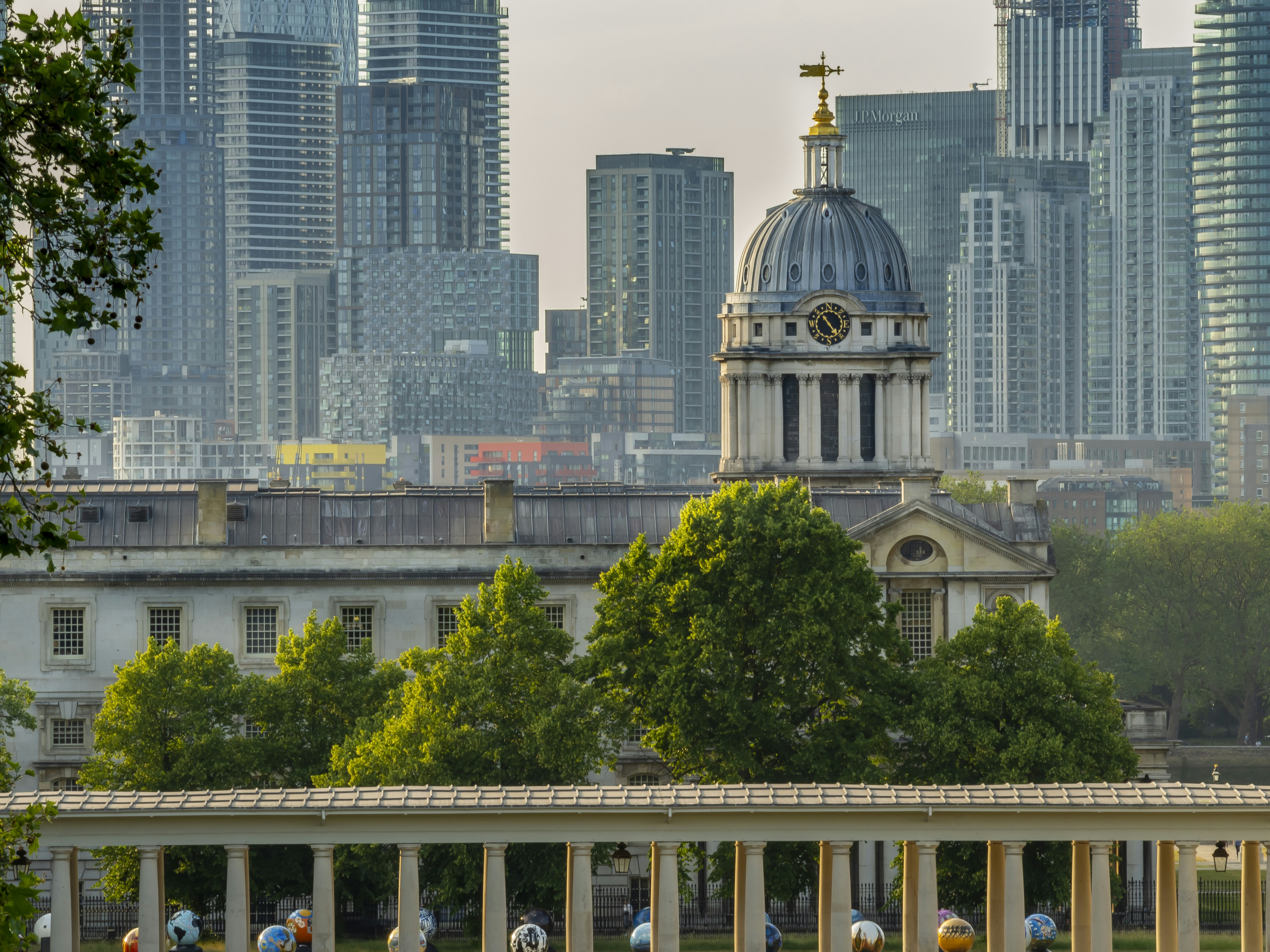 a large building with a clock tower in the middle of a city