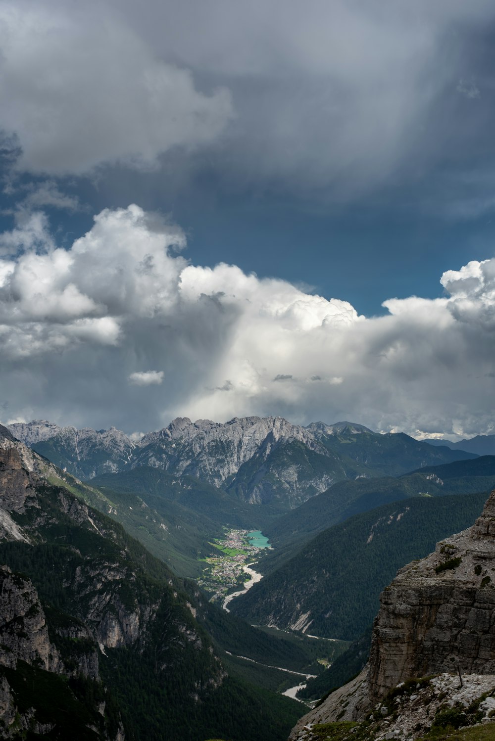 a view of a valley with mountains in the background