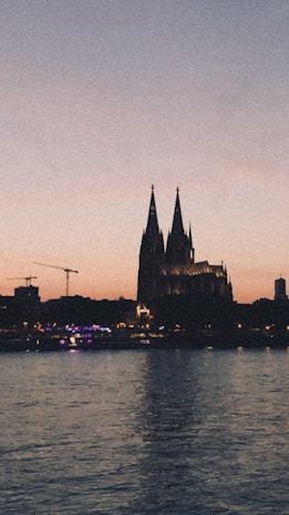 Sunset view over a famous international Catholic pilgrimage site with pilgrims in silhouette