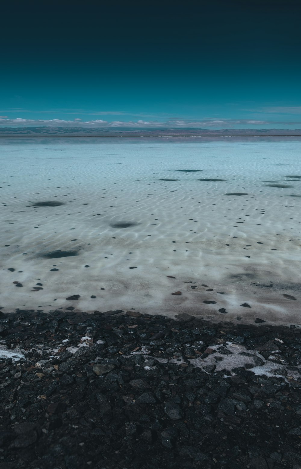 a large body of water surrounded by rocks