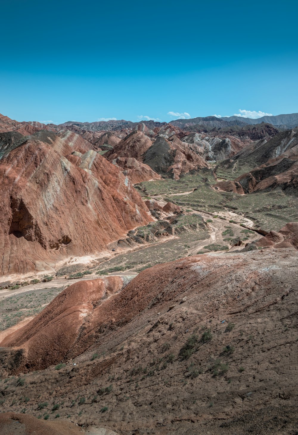 a view of a valley and mountains from a high point of view