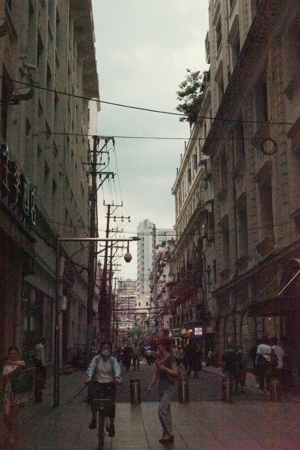 a group of people riding bikes down a street