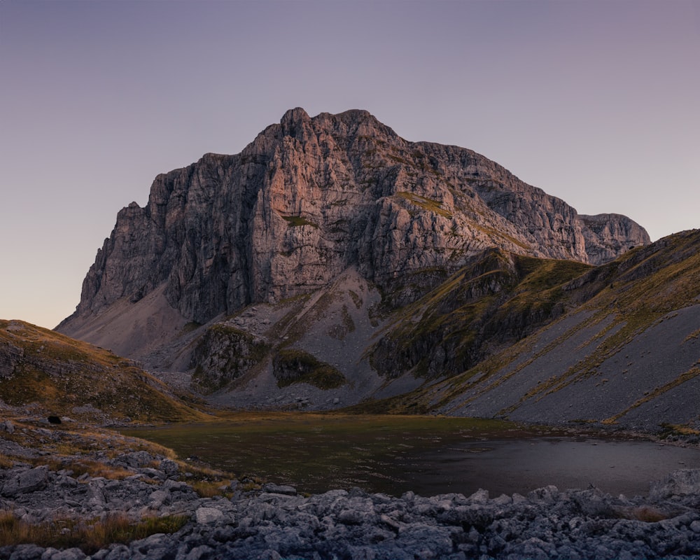 a mountain with a lake in front of it