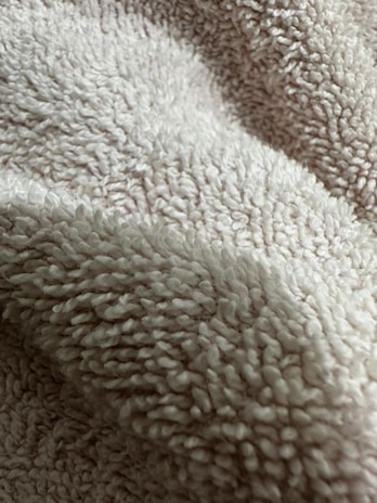 Close-up of slippers’ ultra-soft coral fleece lining highlighting its inviting texture.