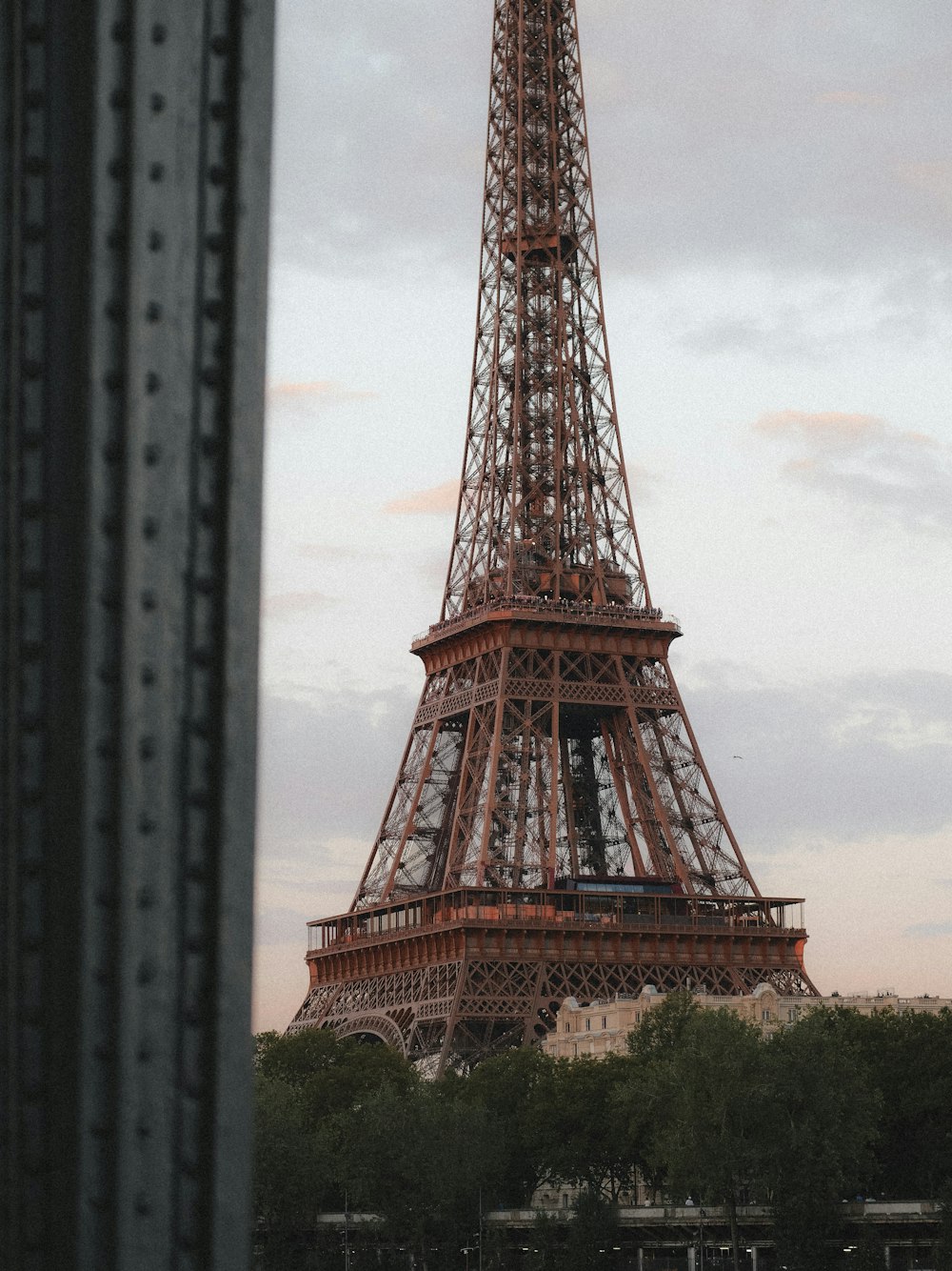 a view of the eiffel tower from across the river