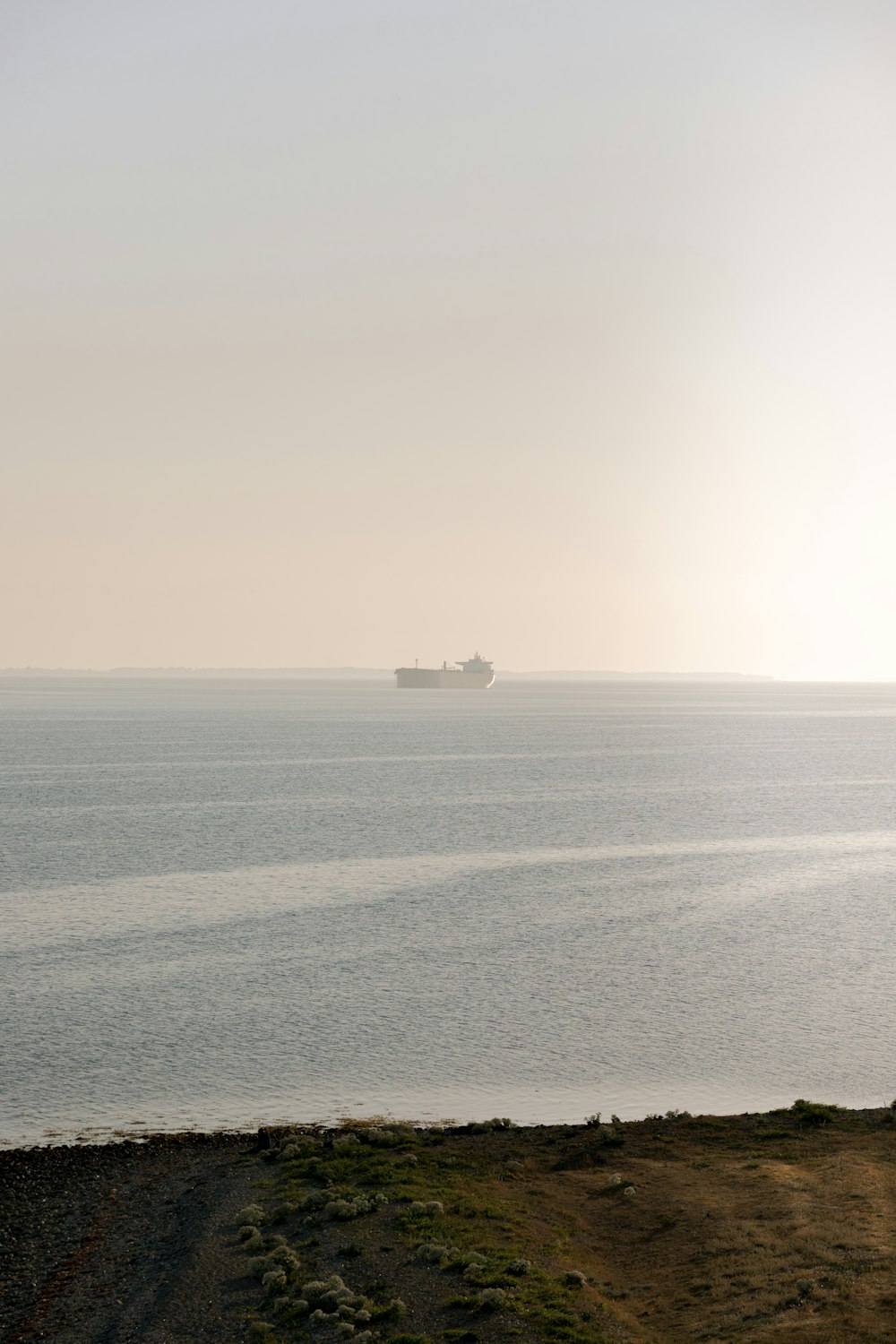 a large ship is out in the open water