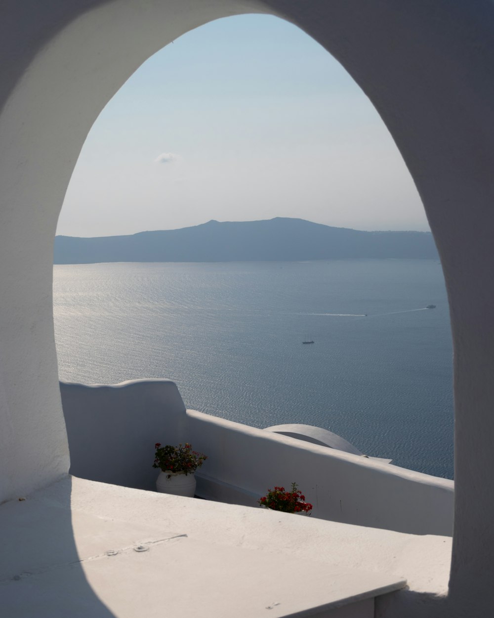 a view of a body of water through a circular window