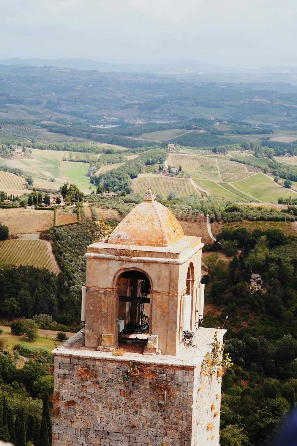 a tower with a bell on top of it