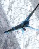 A futuristic, sleek aircraft with a blue and silver design is flying over a snowy mountainous terrain. The structure of the aircraft resembles a combination of a plane and a drone with fins and rotors. The snow on the ground contrasts with the sky and adds a dynamic visual element.