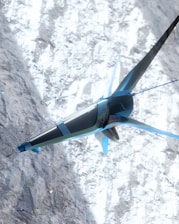 A futuristic, sleek aircraft with a blue and silver design is flying over a snowy mountainous terrain. The structure of the aircraft resembles a combination of a plane and a drone with fins and rotors. The snow on the ground contrasts with the sky and adds a dynamic visual element.