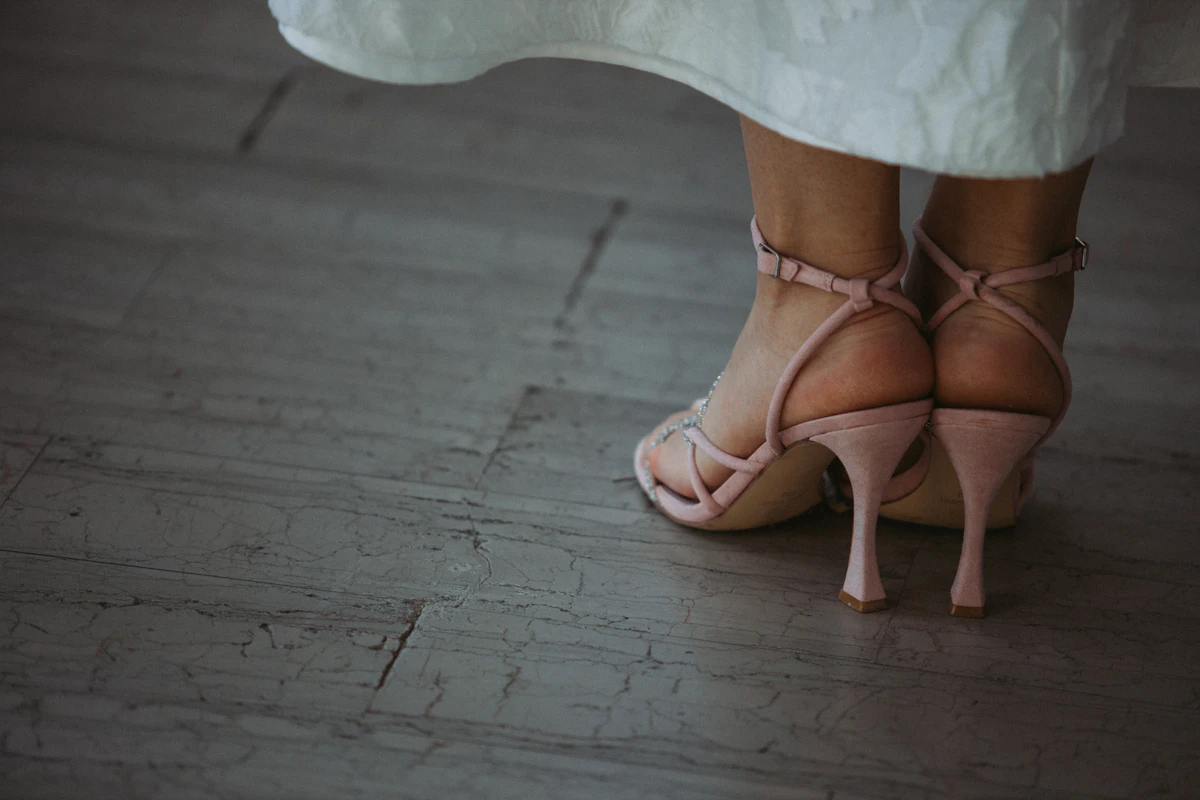 a close up of a person wearing high heels