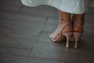 a close up of a person wearing high heels