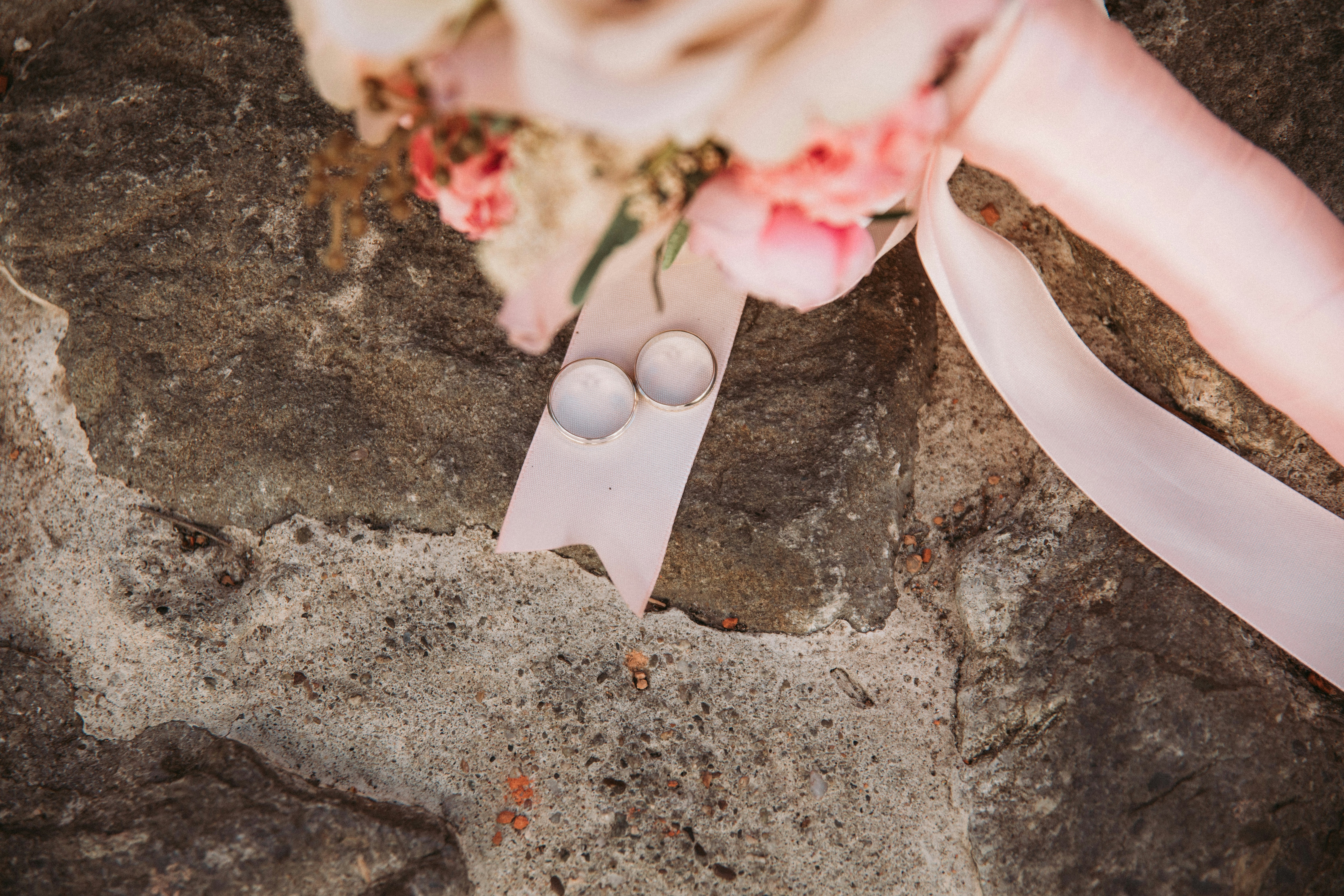 a close up of a pair of scissors on a rock