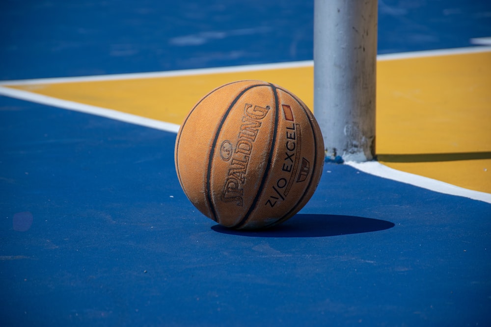 a close up of a basketball on a court