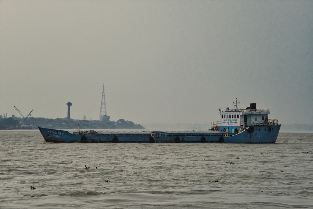 a large boat floating on top of a large body of water