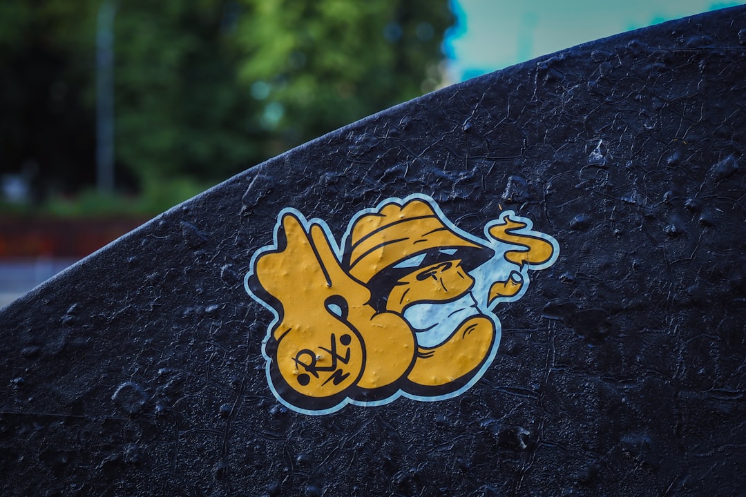 a close up of a skateboard with a sticker on it,