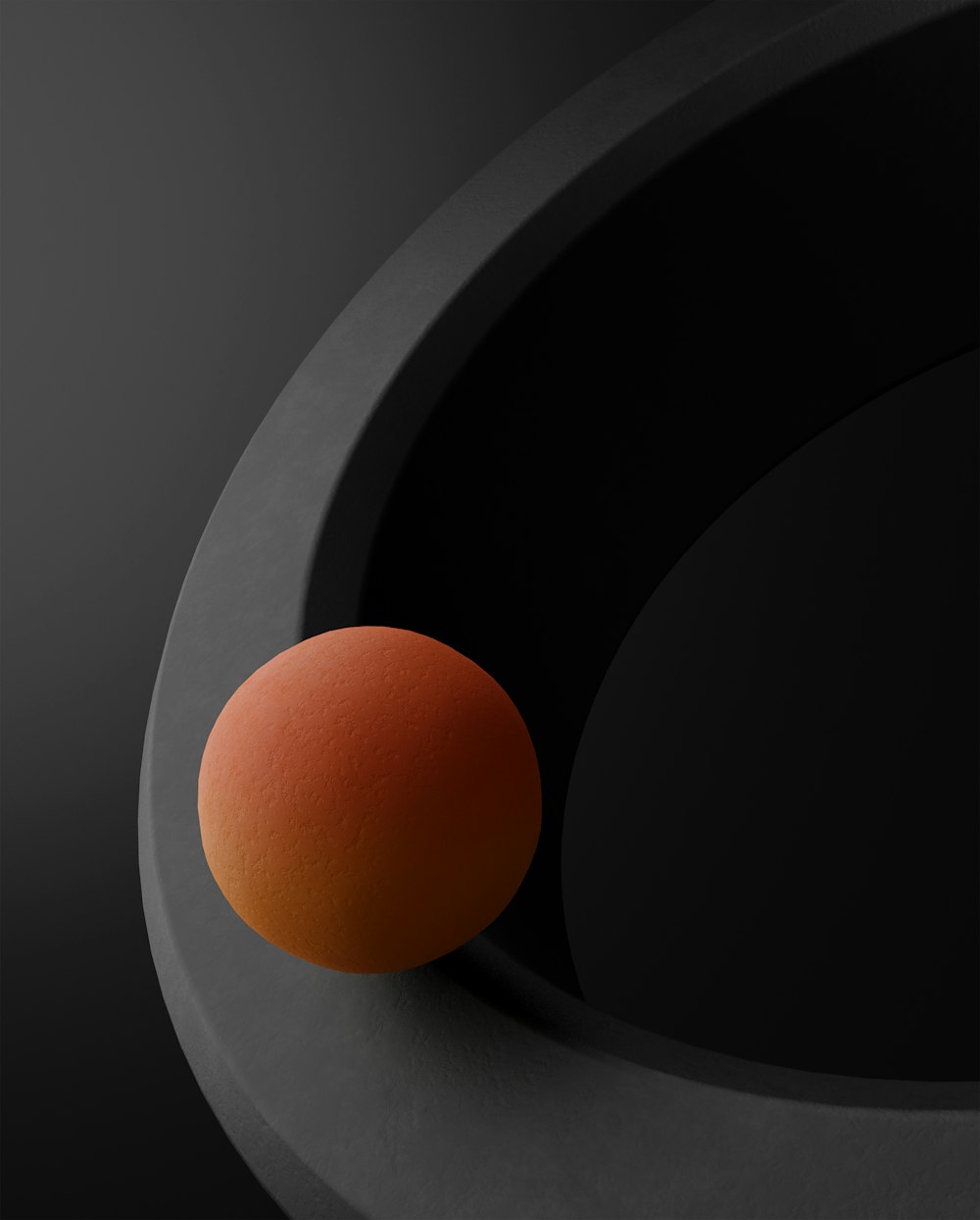a round object with an orange ball in the middle of it