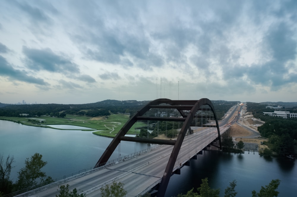 a bridge over a river with a sky background