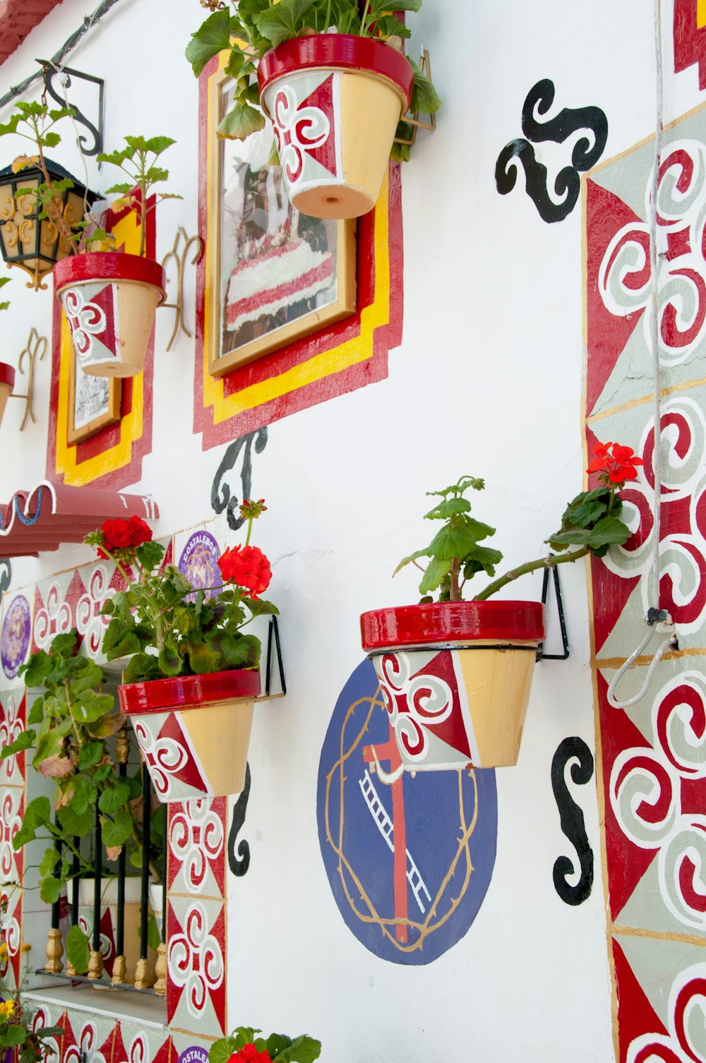 a wall with a bunch of flower pots on it