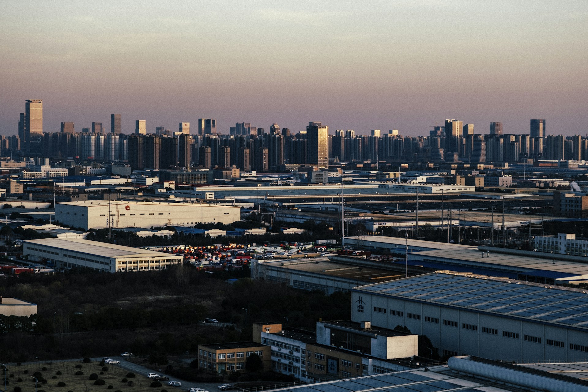 A vibrant image of industrial buildings and warehouses, representing future construction possibilities on the land.