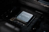 Close-up of a powerful AMD processor glowing under soft lighting.