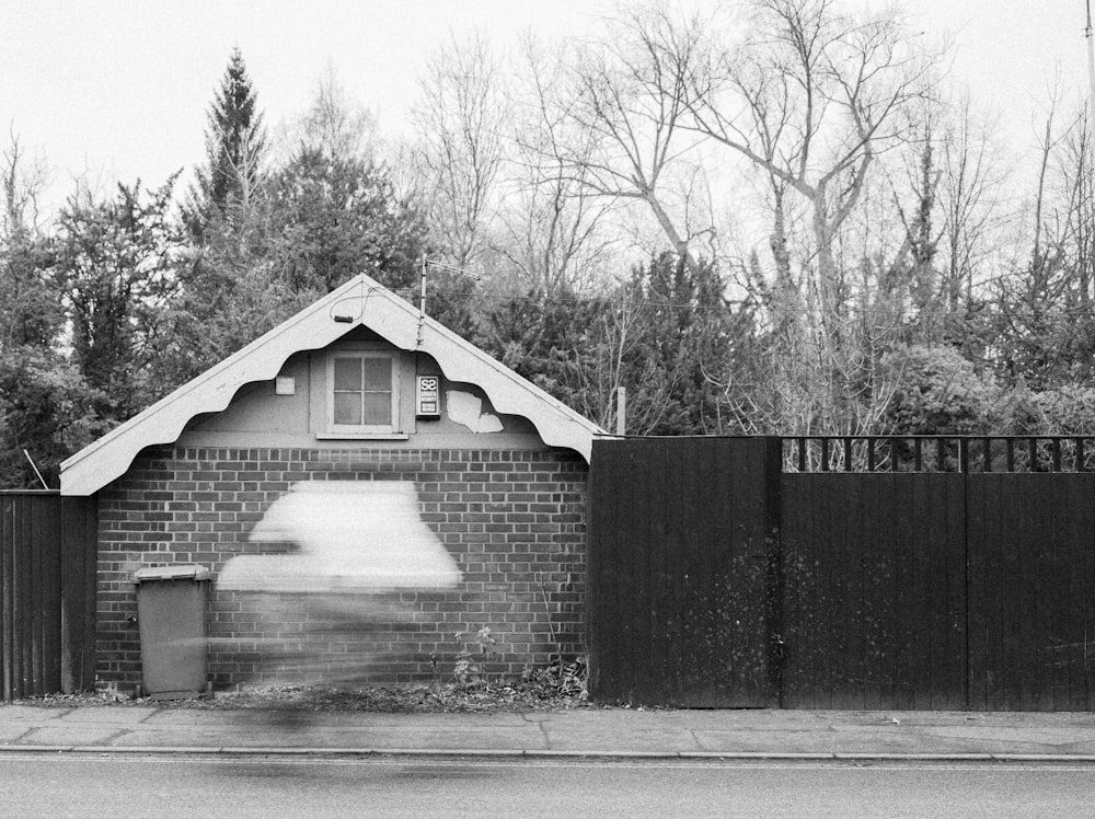 a black and white photo of a brick building