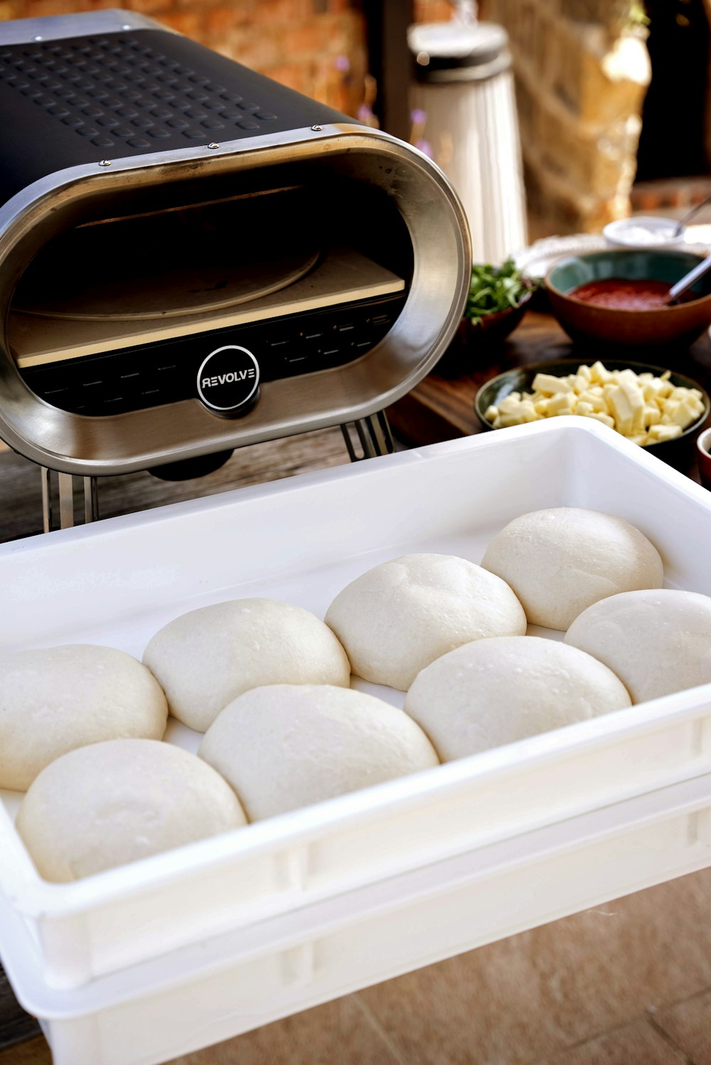 a pan filled with food next to a toaster oven