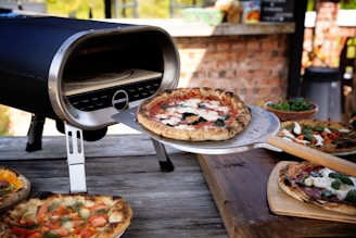 a pizza is being cooked on a grill