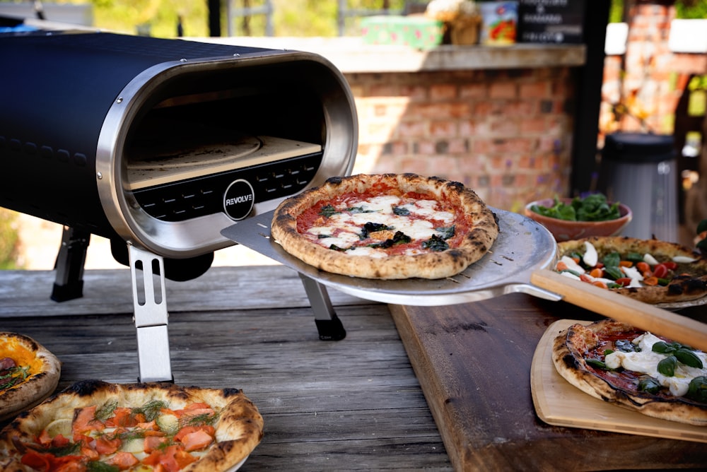 a pizza is being cooked on a grill