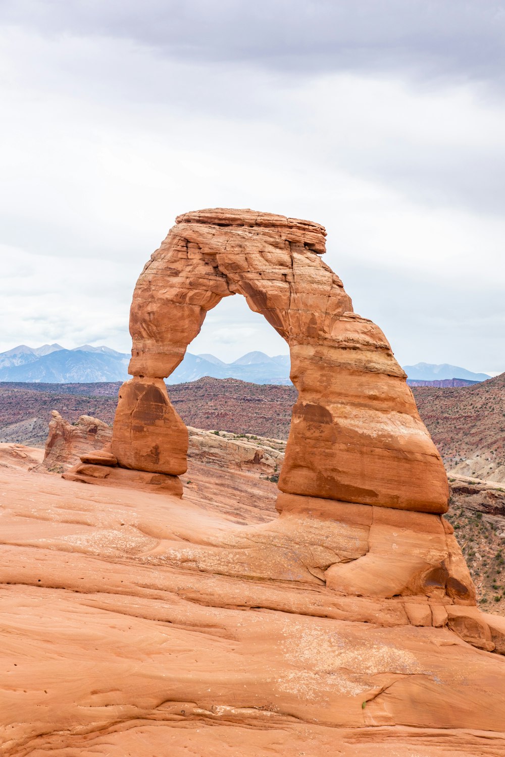 a large rock formation in the middle of a desert