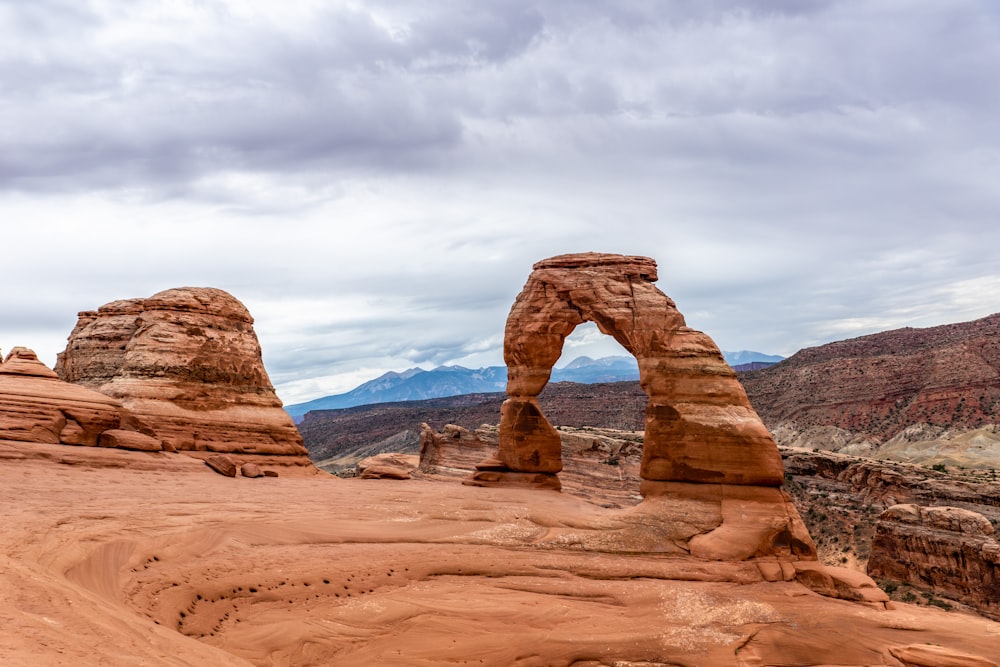 a large rock formation in the middle of a desert