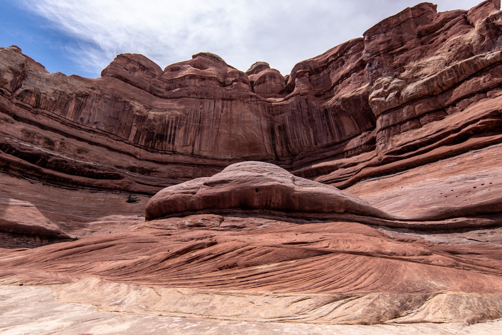 a large rock formation in the middle of a desert