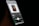 A smartphone screen displaying a music player application with an album cover. The album cover features a silhouette of a person with a hand covering part of their face. The song 'Nights' by Frank Ocean is playing, and the background is dark, highlighting the vibrant screen.
