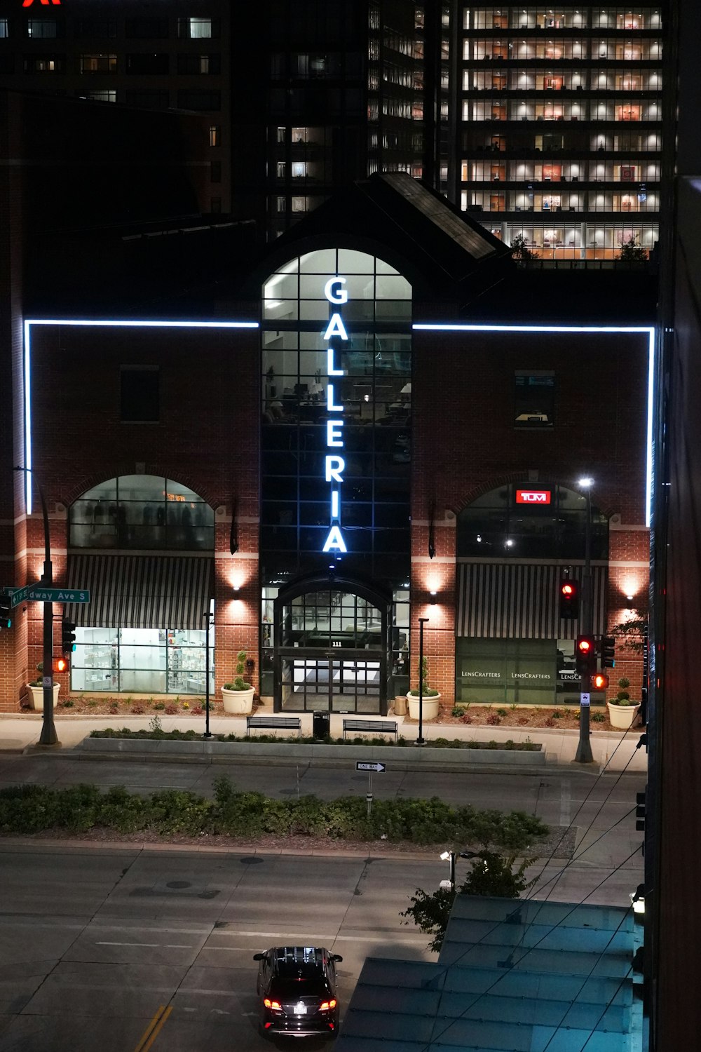 a car is parked in front of a building