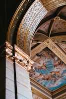 Intricate frescoes inside a centuries-old heritage building showcasing vibrant colors.