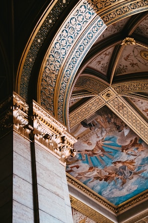 Intricate frescoes inside a centuries-old heritage building showcasing vibrant colors.