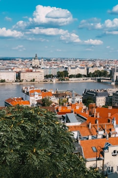 A vibrant image showcasing the Chari River with modern architecture in the background.