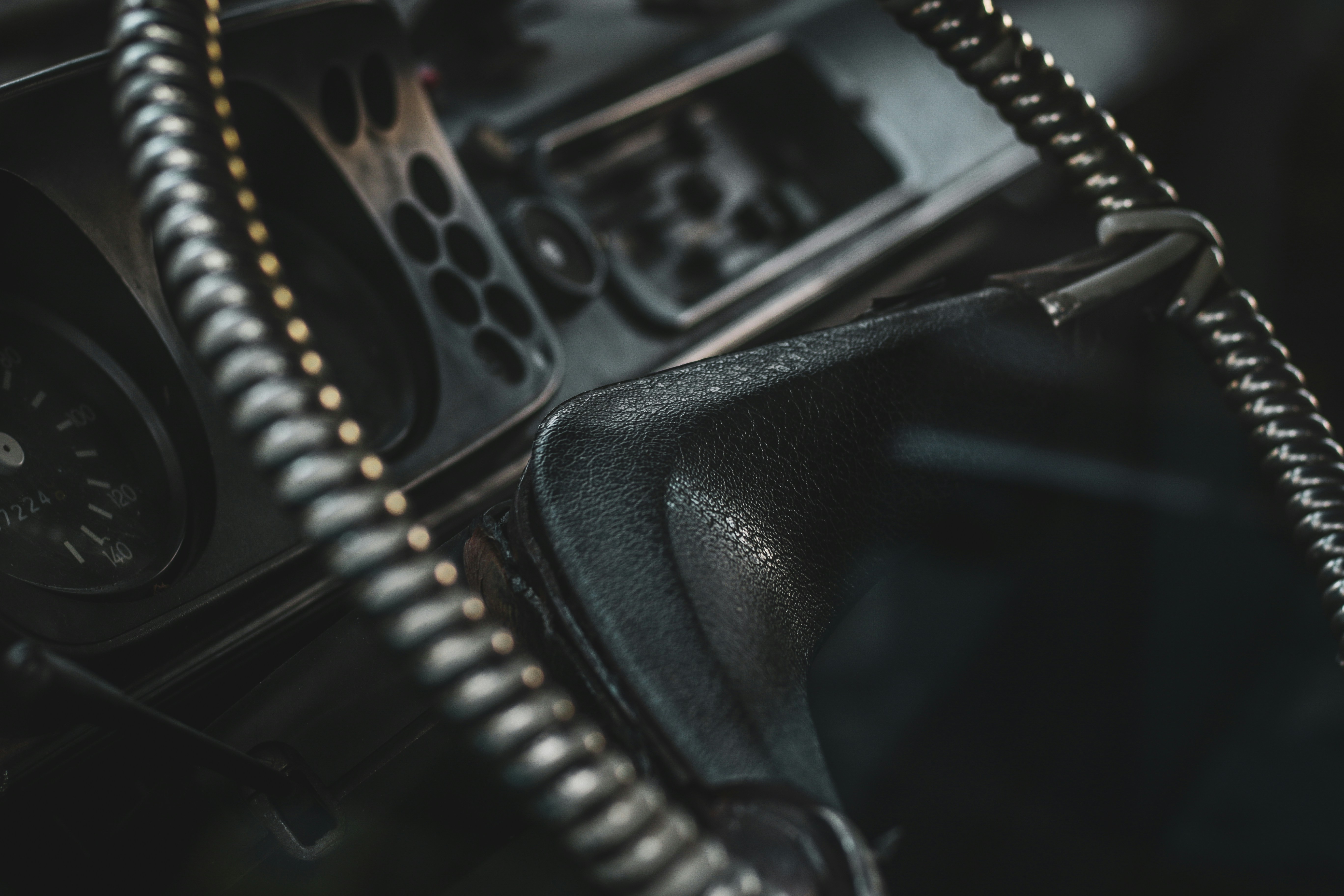 Close-up of car dashboard with a clock