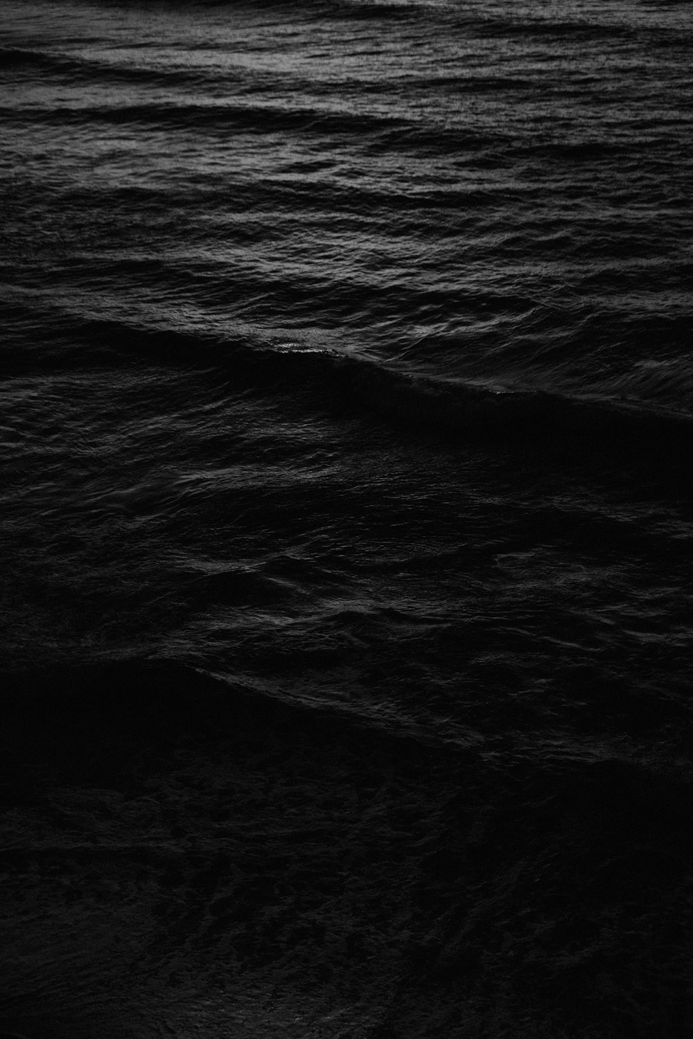 a black and white photo of a body of water