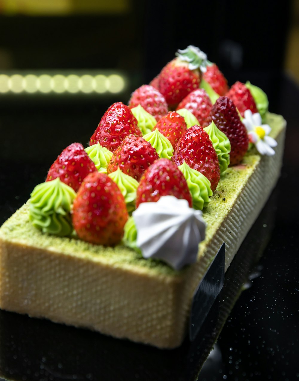 a close up of a piece of cake with strawberries on it