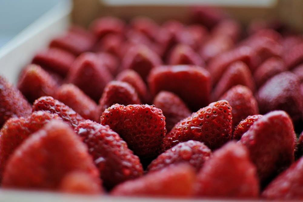 a close up of a box of strawberries